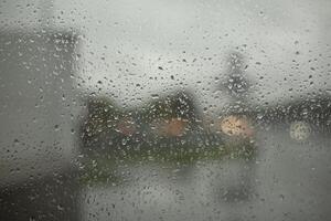 Wet glass. Raindrops on window. It's rainy day. photo