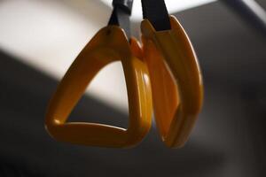 Handrail in the bus. Handrail for the hand in transport. Yellow handle on the belt. photo