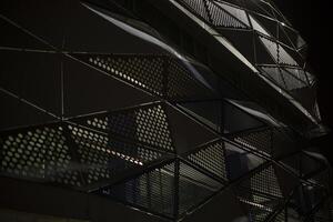 Building in the evening. Modern architecture. Steel beams in the structure. photo