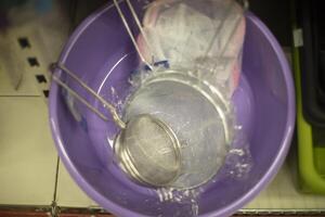 Sale of tableware in store. Tableware on counter. Store details. photo