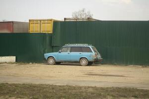 A car in a parking lot in the city. Transport in the yard. A parked car on the street. photo