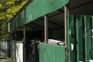 Garbage in city. Place to dispose of garbage. Steel structure for garbage cans. photo