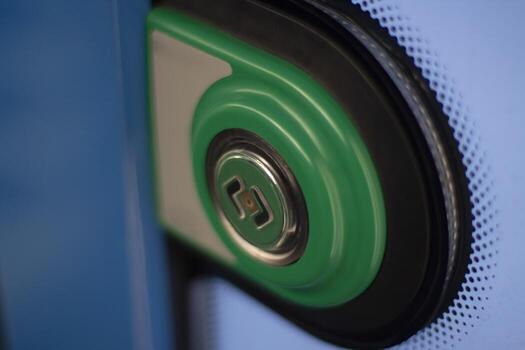 Door open button. Green button on the bus. Bus door control. photo