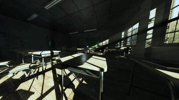 Abandoned classroom with sunlight casting shadows on empty desks video