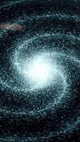 Galaxy in deep space of a spiral form rotating on black background, seamless loop. Animation. Flying through star fields and nebulas in space, revealing a spinning spiral galaxy. video