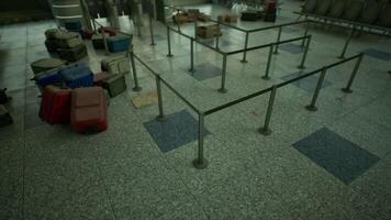Abandoned airport terminal with scattered luggage and empty check in area video