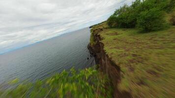 FPV drone flight over rocky shore video