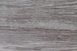 A close up of a wooden surface with a white background photo