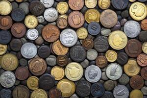 A wall of coins with different colors and designs photo