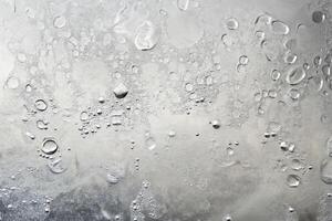 A close up of a window with water droplets on it photo