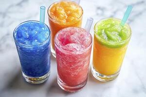 Four different colored smoothies in glasses photo
