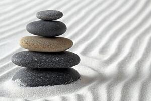 A stack of rocks in the sand photo