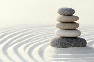 A stack of stones in the sand photo