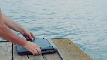 Man's hands using laptop computer. video