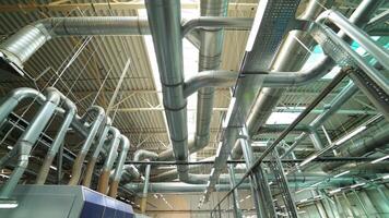 Industrial factory ceiling with ventilation system and lights. Ventilation ducts. video
