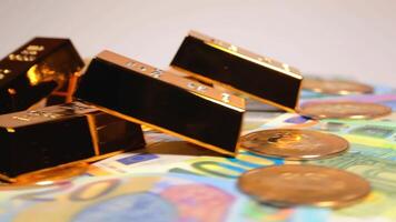 Fine Gold Bars with Bitcoin Coins on the Different Euro Banknotes Rotating. Euro Currency. Colored Paper Money. A Lot of Euro Cash. Income, Earnings, Cryptocurrency, Money Saving and Wealth Concept video