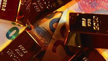 Shiny Gold Bars on the 20 Euro Bills - Top View. Euro Money Currency. A Lot of Twenty Euro Banknotes. Success, Finances and Wealth Concept - Slow Rotation Right video