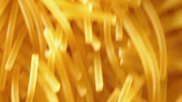 Background of Uncooked Noodles Moving Up - Top View, Close Up. Raw Pasta in Move. Texture of Dry Vermicelli video