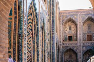 Samarkand, Uzbekistan-august 12, 2023-Particular of the Registan square occupied by a large complex made up of 3 madrasas photo