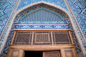 Samarkand, Uzbekistan-august 12, 2023-Particular of the Registan square occupied by a large complex made up of 3 madrasas photo