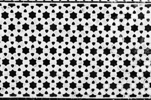 Colorful vintage surface with an old oriental pattern. The background is a texture that has a decorative value. For overlay or texture designs photo