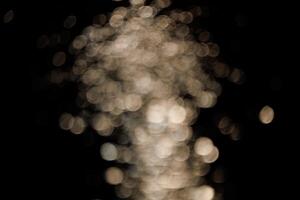 Blurred bokeh with sparkling water glitter with cool mist flash effect photo