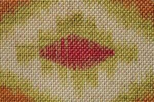 Colorful vintage surface with an old oriental pattern. The background is a texture that has a decorative value. For overlay or texture designs photo