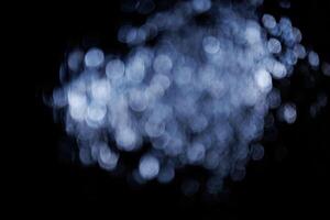 Blurred bokeh with sparkling water glitter with cool mist flash effect photo