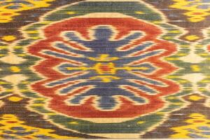 Colorful vintage surface with an old oriental pattern. The background is a texture that has a decorative value. For overlay or texture designs photo