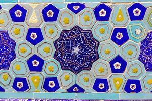 Colorful vintage surface with an old oriental pattern. The background is a texture that has a decorative value. For overlay or texture designs photo