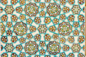 Colorful vintage surface with an old oriental pattern. The background is a texture that has a decorative value. For overlay or texture designs photo