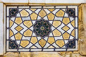 Colorful vintage surface with an old oriental pattern. The background is a texture that has a decorative value. For overlay or texture designs photo