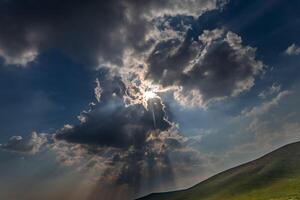 Background heaven with expressive textures of clouds and rays of the sun photo