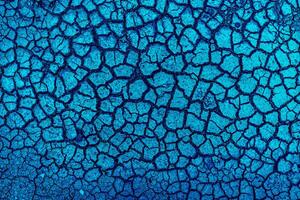 Earth with cracks top view for background or graphic design of textures and overlays with the concept of drought and death. photo