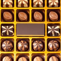 Box of chocolate with business card top view photo
