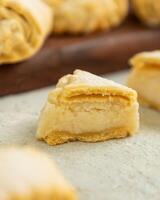 Freshly baked pastry filled with sweet cream cheese filling on table photo