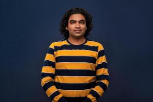 Portrait of happy young man on gray background. photo