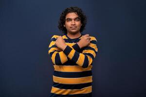 Portrait of a man crossing hands and showing palm, stop gesture, warning of end finish, forbidden way. indoor studio shot on gray background photo