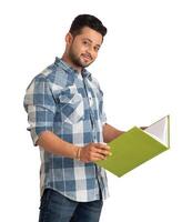 Young happy man holding and posing with the book on white background. photo