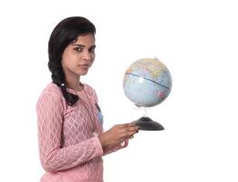 Beautiful Girl holding a world globe isolated on a white background photo