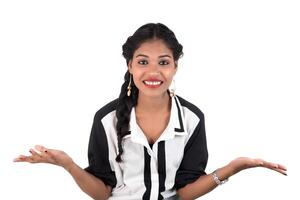 Portrait of beautiful young smiling girl posing on white background photo