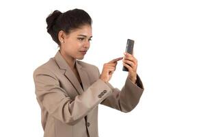 business woman using a mobile phone or smartphone isolated on a white background photo