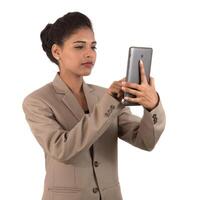 business woman using a mobile phone or smartphone isolated on a white background photo