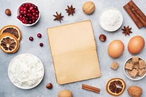 Ingredients for baking cookies, cupcakes and cake. Frame of Raw foods eggs flour sugar cottage cheese cranberries on a grey background with copy space. photo