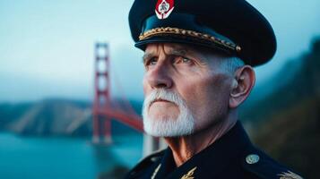 Older veteran in uniform before the Golden Gate Bridge with fog rolling in from the bay photo