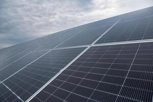 Solar power station or panels, photovoltaics, alternative source of electricity. Concept of sustainable and renewable sources. photo