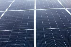 Solar panel on green grass background. Alternative energy source. Solar panel. photo
