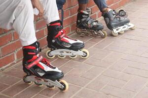 Inline Skates with leg on road photo