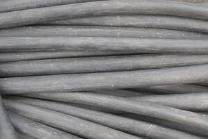 A Background of black colored plastic pipe photo