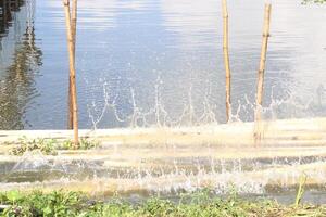 Water Splash on pond from hit photo